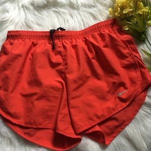 Red Nike shorts